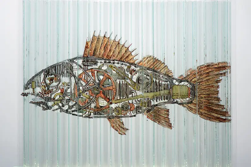 Page with technical interior of fish from glass cube with four anamorphic paintings