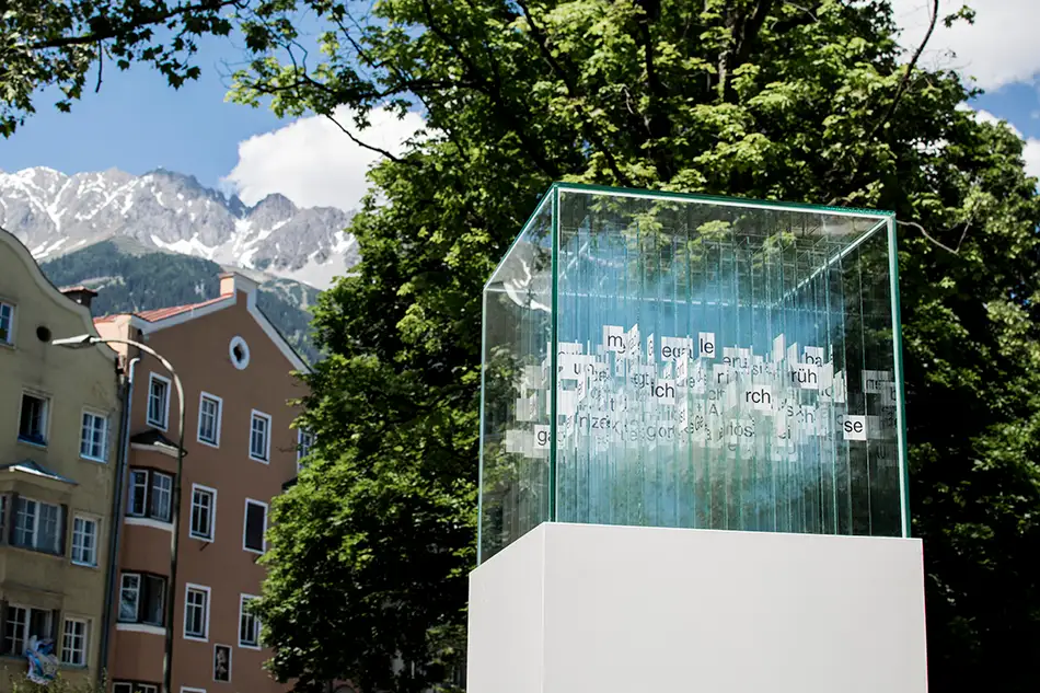Anamorphic glass art installation called 404 Ort with text by Martin Fritz