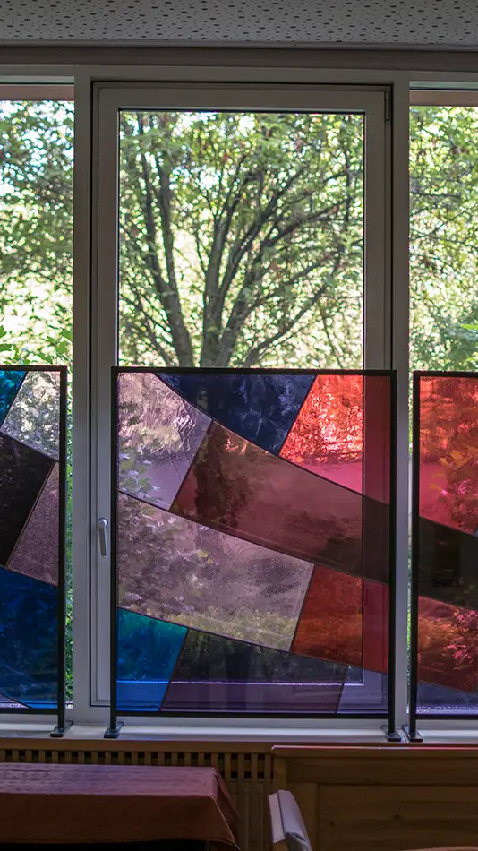 Colourful stained glass as a privacy screen for a care home