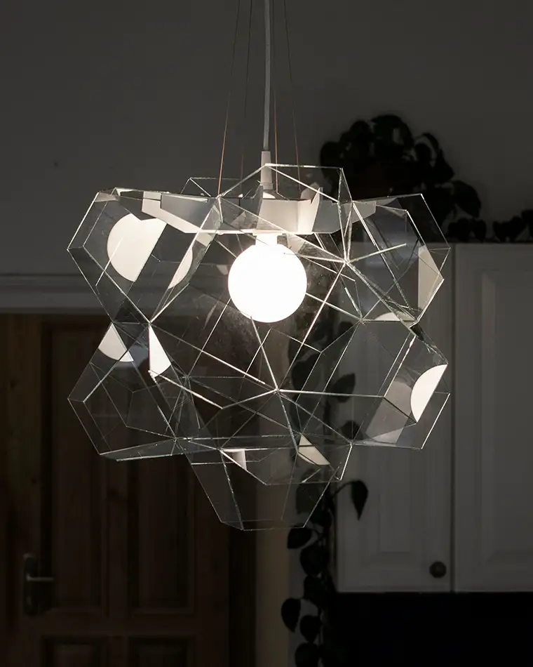 Geometric lampshade made of fabless glass at night