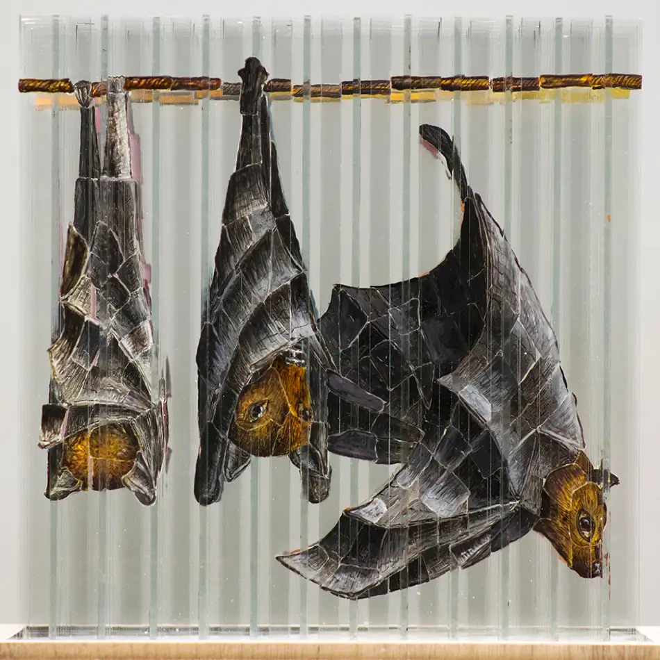 Anamorphic glass art with four fragmented images - bats