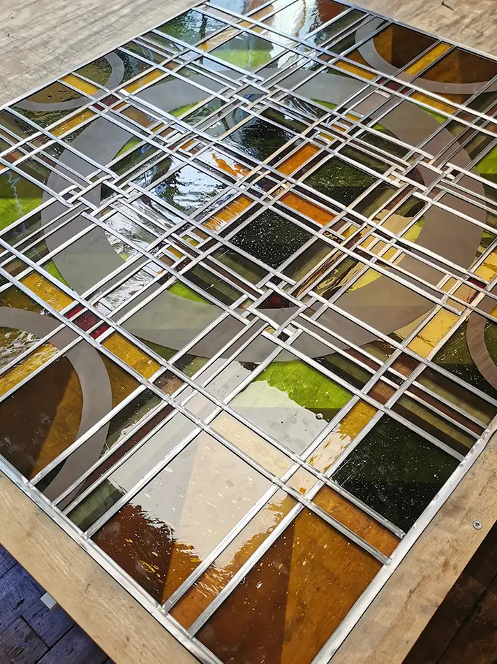 new-production of stained glass windows for the Dominikanerkirche Eppan - one leadlight on the workshop table