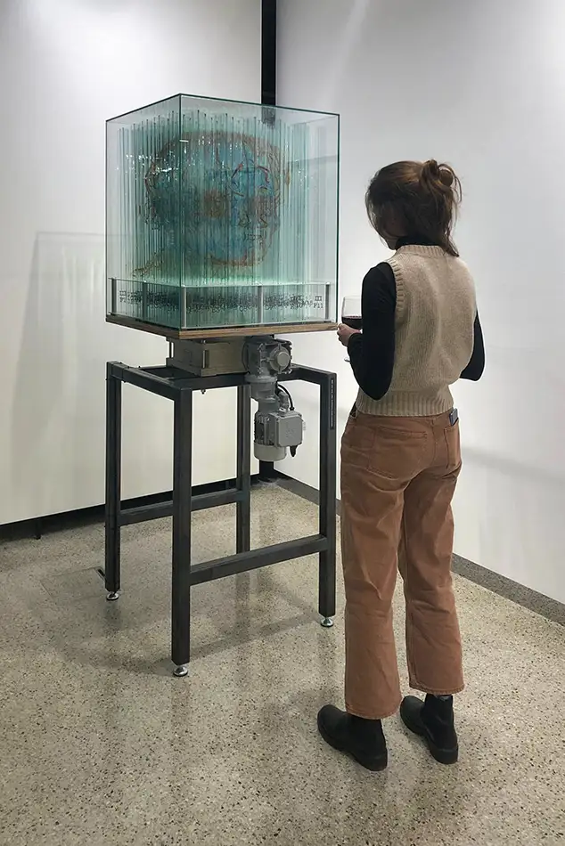 Below The Surface Is Another Surface - glass art installation - gallery view with person