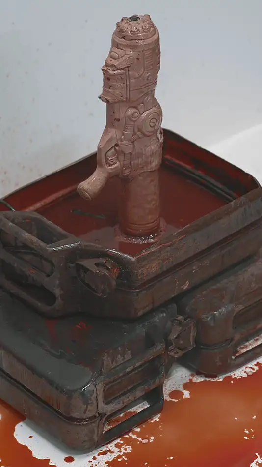 Fountain of Normalised War - Blood fountain made from a concrete cast of a spray gun and rusty petrol cans - detail