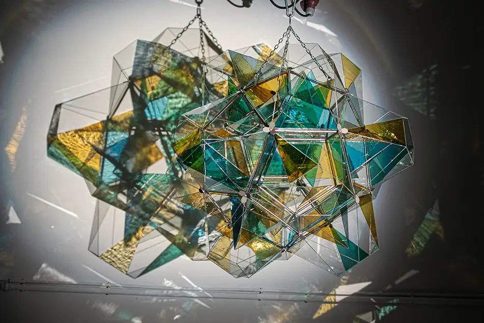 polyhedra - dodecahedron glass art object - with a spotlight