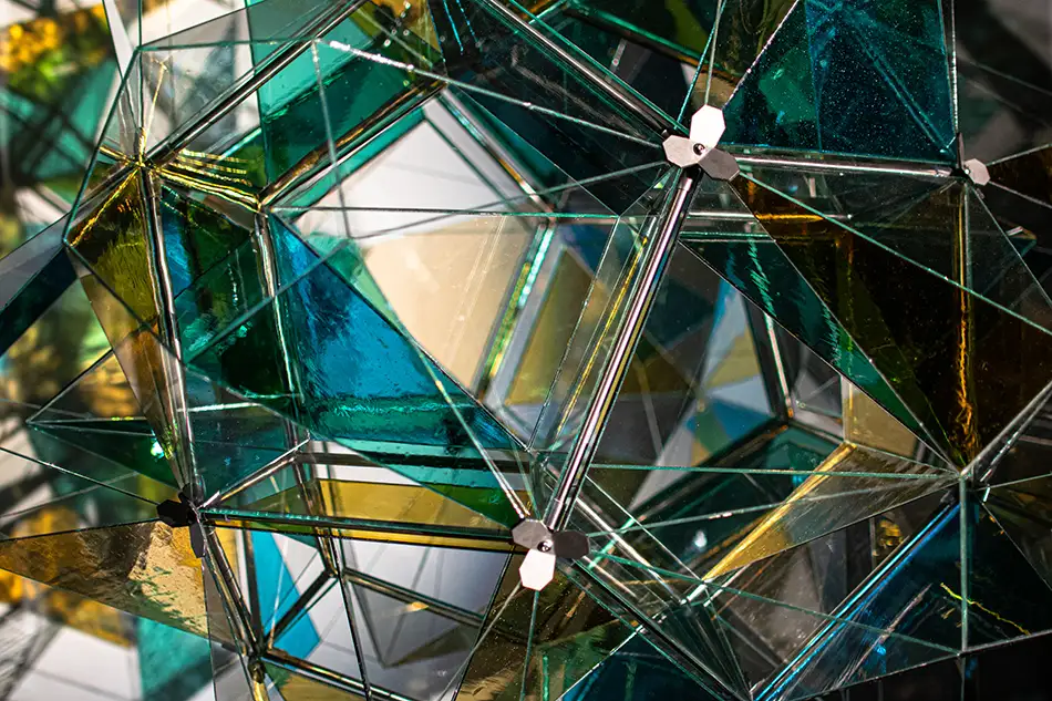polyhedra - dodecahedron glass art object - detail with a spotlight