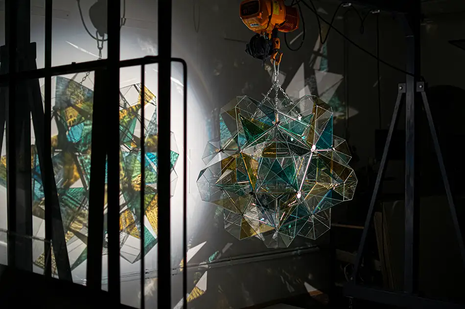 polyhedra - dodecahedron glass art object - workshop view